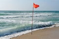 A warning Red flag of danger at sea Royalty Free Stock Photo