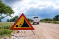 Warning of road sign - falling stones on the road