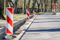 Warning road signs on the side of the street during the performance of repair work Royalty Free Stock Photo
