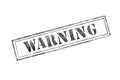 `warning ` rubber stamp over a white background Royalty Free Stock Photo