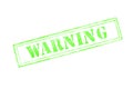 `warning ` rubber stamp over a white background