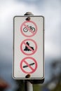 Warning sign banning bicycles, roller blades and skate boards Royalty Free Stock Photo