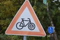 warning sign for bikes at a crossing of bike road and road Royalty Free Stock Photo
