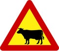 Warning sign with cattle on road Royalty Free Stock Photo