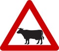 Warning sign with cattle on road Royalty Free Stock Photo