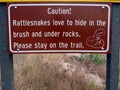 A warning sign in cautioning about rattlesnakes