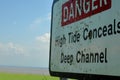 Warning sign on the coast Royalty Free Stock Photo