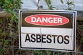 A warning sign Danger Asbestos on a fence at site rehabilitated post asbestos contamination Royalty Free Stock Photo