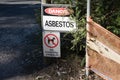 A warning sign Danger Asbestos on a fence at site rehabilitated post asbestos contamination Royalty Free Stock Photo