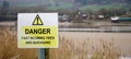 Warning sign - Danger - tides and quicksand, United Kingdom