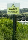 Warning sign Danger - tides and quicksand, United Kingdom