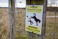 Warning sign: dangerous animal - horse kicks can kill. Warning sign on horse pasture.