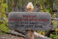 Warning sign dangerous drop ahead stay away from cliff edge Royalty Free Stock Photo