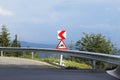 Warning sign on dangerous mountain road