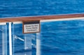 Do Not Throw waste overboard warning sign on cruise ship