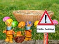 Warning sign Easter holidays with Easter bunny and basket Royalty Free Stock Photo