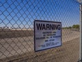 Warning sign at a fence to McCarran International Airport - LAS VEGAS - NEVADA - OCTOBER 12, 2017 Royalty Free Stock Photo