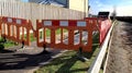 Warning sign and fenced work being carried out on the footpath