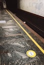 Warning sign on the floor of Kyiv metro station