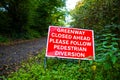 warning sign that the footpath is closed ahead pedestrians to follow a diversion