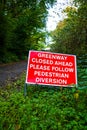 warning sign that the footpath is closed ahead pedestrians to follow a diversion