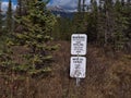 Warning sign in forest near Jasper, Rocky Mountains, informing about gas pipeline operated by Canadian company ATCO Ltd.