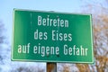 Warning sign in German \'Betreten des Eises auf eigene Gefahr\' close up