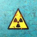 Warning sign indicating the presence of a radioactive area, nuclear site, sign hanging on a wall