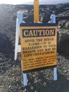 Warning sign at the Kalapana Lava flow from volcano into ocean at KÃÂ«lauea Big Island Hawaii