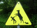 A warning sign about mother deer protecting her baby fawn, and for people not to get too close Royalty Free Stock Photo