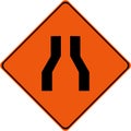 Warning sign with narrow road