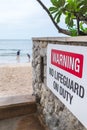 Warning sign of no life guard on duty by the beach Royalty Free Stock Photo