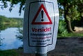 Warning Sign for Oak Processionary Moth Caterpillars (Eichenprozessionsspinner) at Lakeside in Brandenburg, Germany Royalty Free Stock Photo