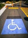 Warning sign on the parking lot for Handicap-Accessible Parking Spaces Needed. Royalty Free Stock Photo