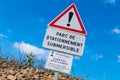 warning sign - parking one side only and liable to flooding Royalty Free Stock Photo