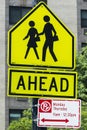 Warning sign of pedestrians crossing road ahead near school Royalty Free Stock Photo