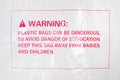 Warning sign on a plastic bag