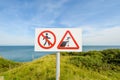 A warning sign at Pointe du Hoc along the Normandy coast of France, site of world war 2 battles