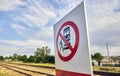 Warning Sign Prohibiting Access to Railway Tracks Under the Bright Sunlight Royalty Free Stock Photo