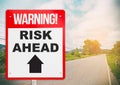 Warning sign on the road ahead say Risk Ahead. Royalty Free Stock Photo