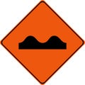 Warning sign with road bumps