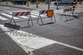 Warning sign on a roadblock red and white street barricade