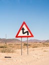 Warning sign sharp turns on the Namib desert, Namibia, Africa.