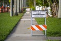 Warning sign that sidewalk is closed at street construction site. Utility work ahead Royalty Free Stock Photo