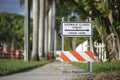 Warning sign that sidewalk is closed at street construction site. Utility work ahead Royalty Free Stock Photo