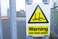 A warning sign stating anti climb spike