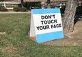 Warning sign stating donÃ¢â¬â¢t touch your face