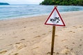 Warning sign for swimming in the sea, beware of jellyfish, placed on the beach