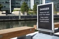 DANGER deep water sign at Canary Wharf, London.