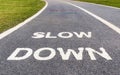 Warning sign to slow down marked on street, safety concept. Royalty Free Stock Photo